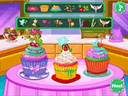 Colorful Cupcakes For Love game image showing a tray of beautifully decorated virtual cupcakes with rainbow sprinkles, pink frosting, and cherries.