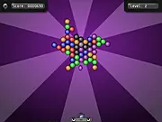 Spin fast-paced bubble shooter online game screenshot showing colorful, rotating bubbles and an explosion effect