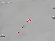 Screenshot of the Shoot the UFOs space shooter game showing a player's ship firing a laser at several retro-style alien UFOs in a dark, starry sky. Play the free online game.