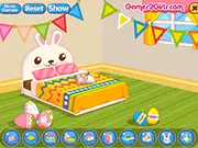 Easter Bedroom Design free online game screenshot showing a fully decorated bedroom with spring colors, bunny ear headboard, and festive Easter decorations