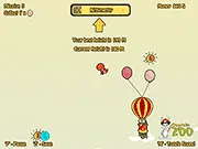 Kitty Up game screenshot showing a cute cartoon cat holding a bundle of balloons while dodging a falling black bomb, free online arcade game on PlayArcadeHub
