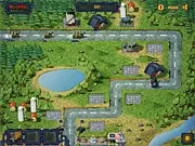 Free online Road of Defense tower defense game screen showing tanks approaching defensive structures