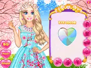 Screenshot of Cherry Blossom Princess Outfits game, showing two beautiful princesses trying on different floral and embroidered spring dresses and kimono-style gowns.