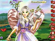 Free online dress up game Love Angel Dress Up, showing a beautiful female angel with large white wings trying on a glittering pink gown