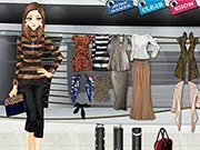 Screenshot of Earthy Tones Dress Up game, showing a female model and a collection of neutral-colored clothing, including brown sweaters and black skirts. Play the free online fashion game.
