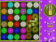 Screenshot from the Flower Action Puzzle free game showing a grid of colorful flowers and the player preparing to slide a row horizontally to make a match.