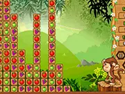 Screenshot of Fruits Monkey game showing colorful groups of fruits descending on a puzzle board with a cartoon monkey character at the bottom