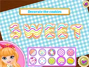 Baby Princess Sisters Surprise free online game screenshot, showing two baby princesses baking and decorating cookies for their mother.