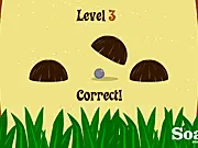 Screenshot of Coconut Curumba game showing three coconuts on a beach with one covering a small rock.