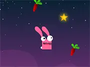 Madpet Skyjumper game screenshot of MadRabbit bouncing off a carrot platform in the sky, collecting stars.