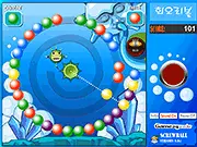 Screw Ball free online game screen showing a colorful spiral of balls moving towards the center and a cannon ready to shoot a match
