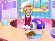 A close-up of a beautifully decorated virtual cupcake from the Candy Cup Cake free online baking game, covered in colorful frosting and assorted candies
