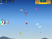 Hot Air Balloon Flight free online arcade game, showing a colorful balloon collecting funds and dodging floating bombs in the sky on PlayArcadeHub.