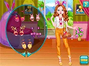 Happy Easter Holiday Dress-Up game screen showing a stylish Easter bunny wearing a spring outfit with facepaint and colorful nails