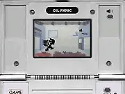 Play Oil Panic Classic Online free game, a man catching oil leaks in a bucket at a gas station