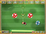 Screenshot of Fruitland 2 online game showing the character jumping to collect colorful hidden fruits in a bright, platforming level.