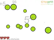 Gameplay screenshot of the free online game Podz showing several bright green circles ready to be clicked and popped.