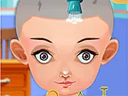 Screenshot of Baby Hair Loss Doctor game showing a doctor treating a smiling baby's head with medical tools