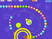 Zuma DIY puzzle game screenshot showing a colorful chain of balls moving toward a hole, with a player's cannon ready to shoot.