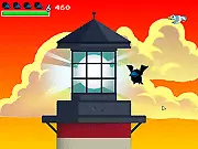 Gameplay screenshot of Treasure Bird in Dreamland online platformer game showing the bird hero jumping near coins and defeating a dark blob enemy