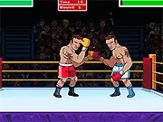 A boxer in the Big Shot Boxing online game celebrating a knockout victory in the ring, with the opponent lying down on the canvas.