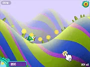 Gameplay screenshot of Hills in Dream online game showing a character speeding down a green hill collecting coins and power-ups