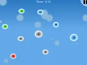 Gameplay screenshot of the Bubble Domination free online strategy game showing one large bubble launching smaller bubbles to attack another color