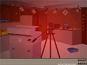 Darkroom Escape free online puzzle game screenshot showing the inside of a mysterious, confined darkroom with red light