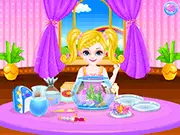 Baby And Mermaid online game screenshot showing the baby with the fish tank and the mermaid in a spa