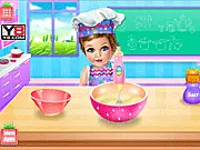 Gameplay screenshot of Baby Eva Cooking School, showing a cute animated girl (Eva) in a kitchen preparing fruity ingredients for a sweet dish.