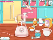 Screenshot from Frozen Fruit Smoothies game showing a tall glass of colorful blended smoothie with fruit garnish and a small cake on the side