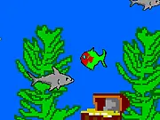 Pixel Fishy arcade game screenshot, a small pixel fish swimming and eating smaller fish to grow bigger