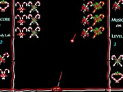 Pop Christmas Candy game screenshot showing a collection of festive sweets (candies, gingerbread, mints) being cleared by a bubble shooter launcher; Play Pop Christmas Candy free online