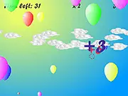 Screenshot of the free online game Balloon Shooter showing various colored balloons floating against a sky backdrop.