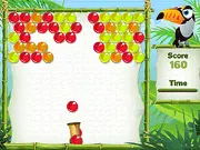 Jungle Boomers online game screen showing a cannon aiming a colorful bubble at a cluster of matching bubbles hanging from a jungle canopy.