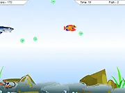 FishPond online free game screenshot showing a small fish eating bubbles and avoiding larger fish in the pond environment.
