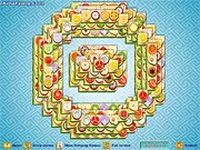 The free online puzzle game Bullseye Mahjong with a board full of fruit tiles arranged in a complex pattern.