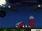 Cowjacked free online game screen showing a UFO abducting a cow with a blue tractor beam over a green farm field.