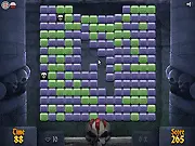 Dungeon Keeper block-breaking game art showing a screen full of brown and gray dungeon blocks being destroyed by a mouse cursor.