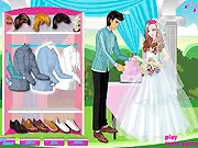 Gameplay screenshot of Groom Dressup showing a handsome groom model standing in a wedding setting, wearing a tailored black tuxedo and white shirt. Play this free online wedding fashion game.