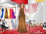 Screenshot of Butterfly Fashion dress up game showing a model wearing an elegant butterfly-themed gown and large decorative wings on a catwalk stage.