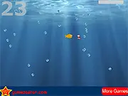 A fish swimming and eating a worm while avoiding many white bubbles in the free online arcade game Bubble Avoider
