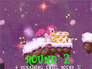 Screenshot of the Cupcake Dreams endless runner game showing Pinkie jumping to collect a cupcake while avoiding a smiling, baked enemy.