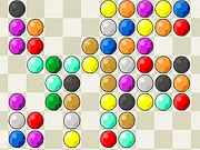 The Twins Deluxe puzzle game screen, showing a grid of colorful bubbles, with a line connecting two identical blue bubbles that has two 90-degree turns