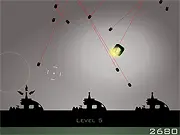Screenshot of MIRC online game showing a central base, small magnetic cubes, and red missiles heading toward the base, illustrating the defense gameplay
