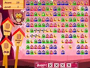 The game screen for Independence Flight showing clustered colored cages holding trapped birds, along with a key icon for removal.