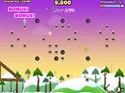 Screenshot of Crazy Go Nuts 2 Mini showing a squirrel being shot from a cannon into the air towards a cluster of nuts on a randomly generated map, play free online game