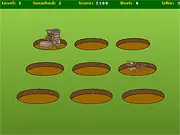 Gameplay screenshot of the free online arcade game Bug Stomper, showing a large boot hovering over several tiny cartoon bugs on the ground.