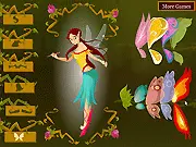 Elf Girl Dressup game screenshot showing a mystical elf maiden with long flowing hair, wearing an elegant fantasy gown, and majestic wings in a magical forest setting.
