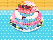 Screenshot of Summer Party Cake decorating game, three-tiered cake with colorful frosting and summer decorations, play free online baking game on PlayArcadeHub